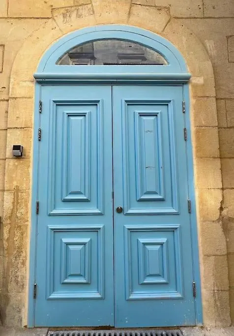 Traditional Townhouse On The Main Street In Valletta Blue Door Malta